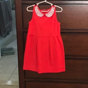 Crew cuts red dress with rhinestone collar.